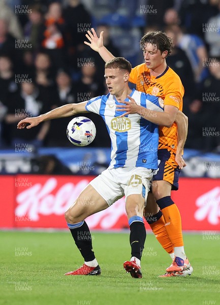 140426 - Huddersfield Town v Cardiff City - Sky Bet League 1 - Will Fish of Cardiff and Dion Charles of Huddersfield