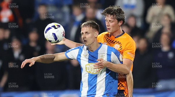 140426 - Huddersfield Town v Cardiff City - Sky Bet League 1 - Will Fish of Cardiff and Dion Charles of Huddersfield