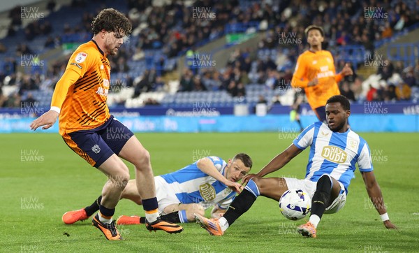 140426 - Huddersfield Town v Cardiff City - Sky Bet League 1 - Ollie Tanner of Cardiff and Bali Mumba of Huddersfield and Murray Wallace of Huddersfield