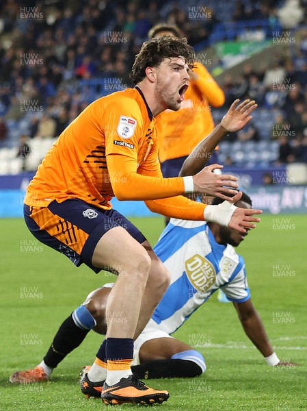140426 - Huddersfield Town v Cardiff City - Sky Bet League 1 - Ollie Tanner of Cardiff Shoots for goal past Bali Mumba of Huddersfield and Murray Wallace of Huddersfield but sees it past the goal