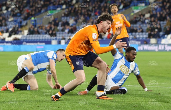 140426 - Huddersfield Town v Cardiff City - Sky Bet League 1 - Ollie Tanner of Cardiff Shoots for goal past Bali Mumba of Huddersfield and Murray Wallace of Huddersfield but sees it past the goal