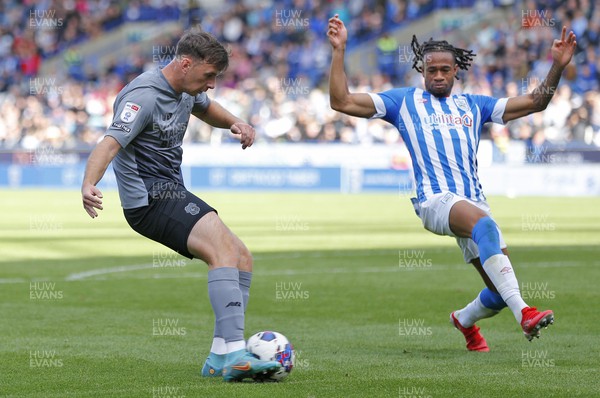 170922 - Huddersfield Town v Cardiff City - Sky Bet Championship - Mark Harris of Cardiff tries a shot but blocked by David Kasumu of Huddersfield