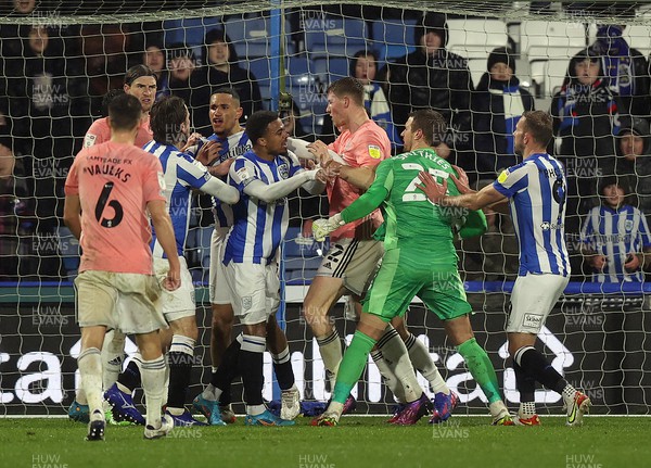 230222 - Huddersfield Town v Cardiff City - Sky Bet Championship - Team mates break up a tussle between goalkeeper Alex Smithies of Cardiff and Jon Russell of Huddersfield