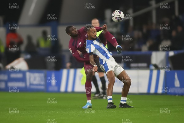 241022 - Huddersfield Town v Cardiff City - Sky Bet Championship - Jamilu Collins and Sorba Thomas fight for the ball