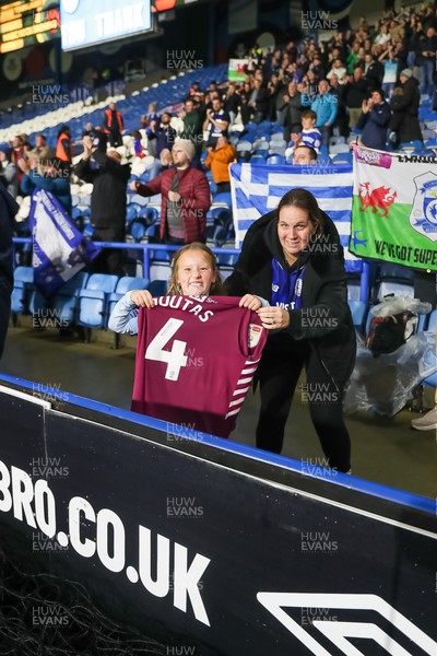 241022 - Huddersfield Town v Cardiff City - Sky Bet Championship - A young Cardiff fan with Dimitrios Goutas' shirt at Full time 