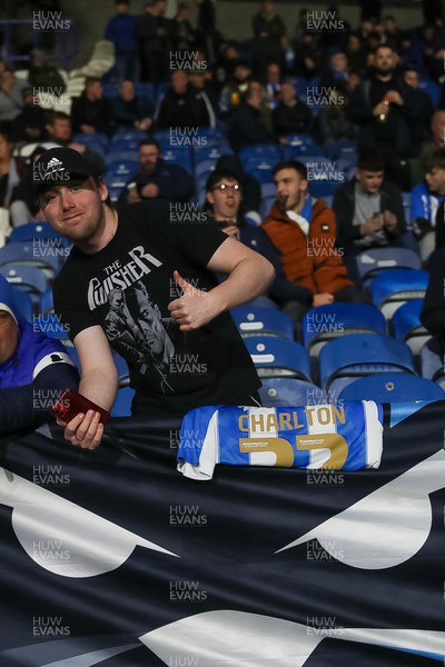 241022 - Huddersfield Town v Cardiff City - Sky Bet Championship - Fan with a Sir Bobby Charlton shirt shows his respects following the recent death of Sir Bobby Charlton