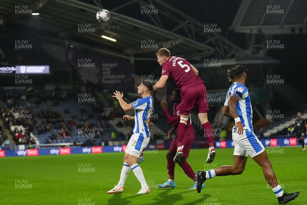 241022 - Huddersfield Town v Cardiff City - Sky Bet Championship - Mark McGuinness heads clear 