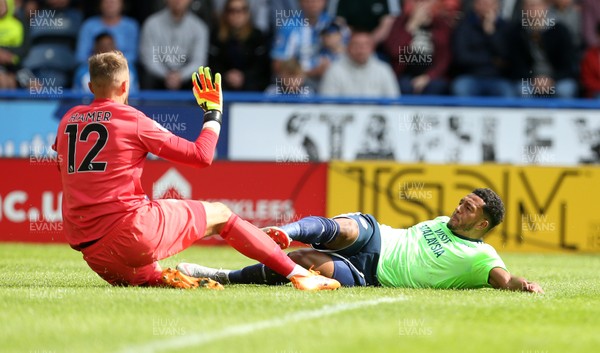 250818 - Huddersfield Town v Cardiff City - Premier League - Nathaniel Mendez-Laing of Cardiff City collides with keeper Ben Hamer of Huddersfield Town and goes off on the stretcher afterwards