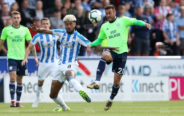 250818 - Huddersfield Town v Cardiff City - Premier League - V�ctor Camarasa of Cardiff City is challenged by Philip Billing of Huddersfield Town