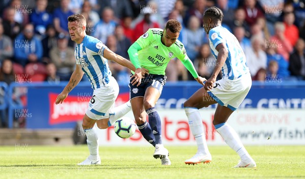 250818 - Huddersfield Town v Cardiff City - Premier League - Josh Murphy of Cardiff City is challenged by Jonathan Hogg of Huddersfield Town