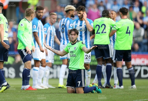 250818 - Huddersfield Town v Cardiff City - Premier League - Harry Arter of Cardiff City confronts the linesman
