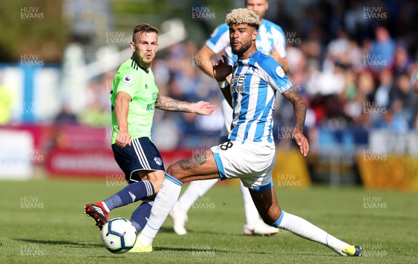 250818 - Huddersfield Town v Cardiff City - Premier League - Joe Ralls of Cardiff City is challenged by Philip Billing of Huddersfield Town