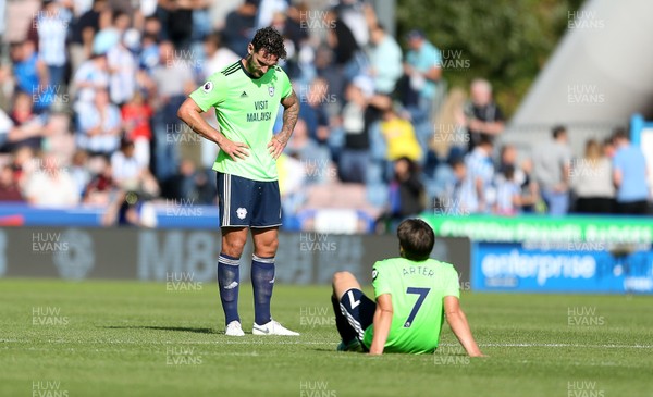 250818 - Huddersfield Town v Cardiff City - Premier League - Dejected Sean Morrison and Harry Arter of Cardiff City at full time
