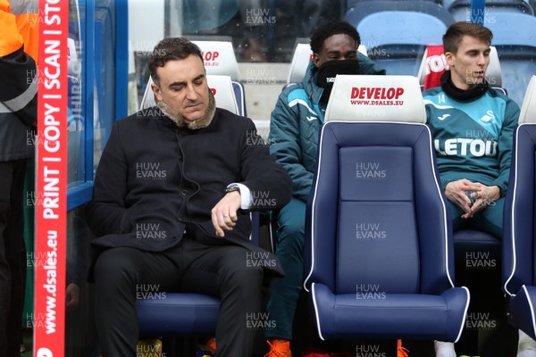 100318 - Huddersfield Town v Swansea City - Premier League - Swansea City Manager Carlos Carvalhal looks at his watch