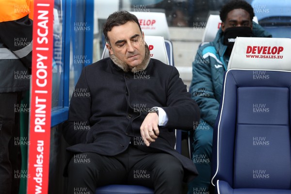 100318 - Huddersfield Town v Swansea City - Premier League - Swansea City Manager Carlos Carvalhal looks at his watch