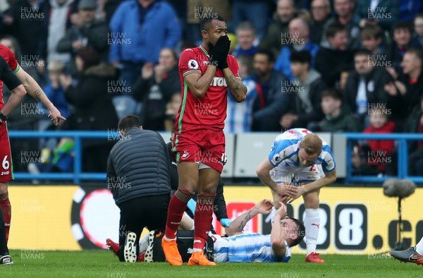 100318 - Huddersfield Town v Swansea City - Premier League - A shocked Jordan Ayew of Swansea after being given a red card for his tackle on Jonathan Hogg of Huddersfield