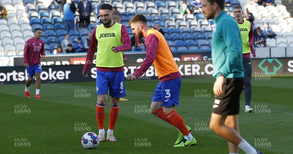 121122 - Huddersfield Town v Swansea City - Sky Bet Championship - Ryan Manning  of Swansea and Matt Grimes of Swansea warm up before the match