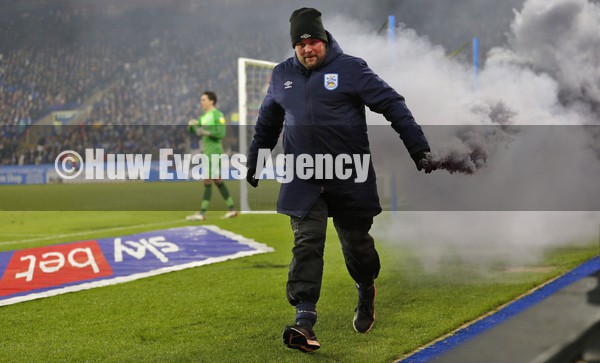 150122 - Huddersfield Town v Swansea City - Sky Bet Championship - Steward takes off flare thrown onto pitch after Swans goal by Swans fans