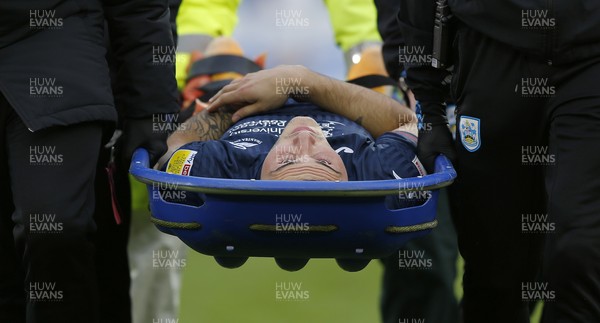200221 - Huddersfield Town v Swansea City - Sky Bet Championship - Jordan Morris of Swansea is stretchered off in the 2nd half with injured left leg
