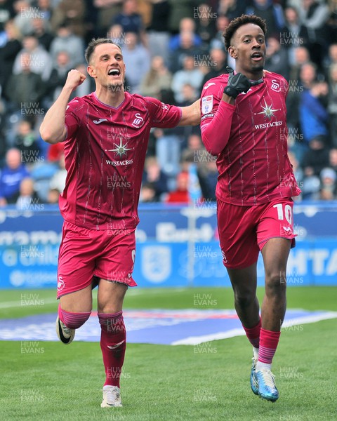 200424 - Huddersfield Town v Swansea City - Sky Bet Championship - Jamal Lowe of Swansea celebrates scoring the 1st goal of the match with Jerry Yates