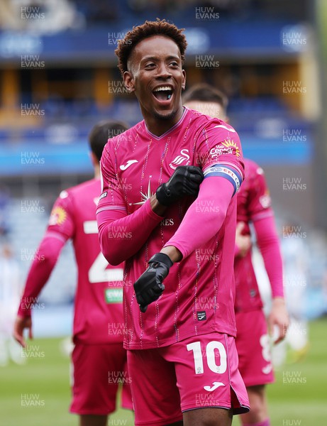 200424 - Huddersfield Town v Swansea City - Sky Bet Championship - Jamal Lowe of Swansea celebrates scoring the 1st goal of the match to the fans with Captain’s armband