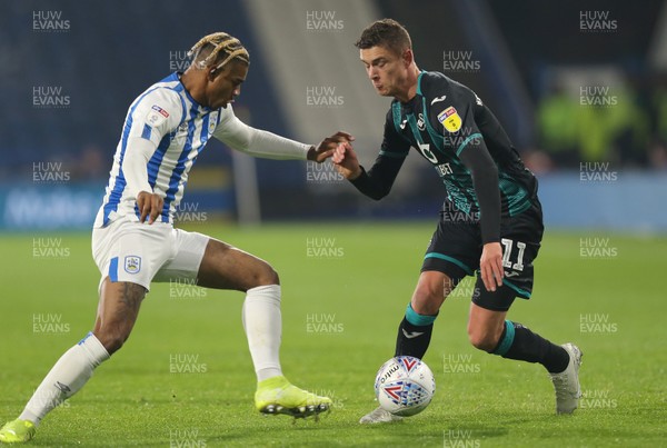 261119 - Huddersfield Town v Swansea City - Sky Bet Championship - Kristoffer Peterson of Swansea and Trevor Chalobah of Huddersfield 