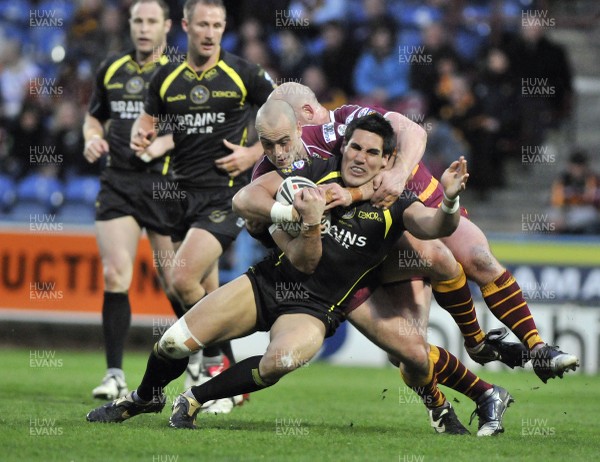 10.04.09.. Huddersfield Giants v Celtic Crusaders, engage Super League -  Crusaders David Tangata-Toa is tackled by Michael Lawrence and Scott Moore  