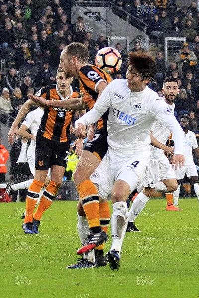 070117 - Hull City v Swansea City, The Emirates FA Cup Third Round - Ki Sung-Yueng of Swansea City and David Meyler of Hull City battle for an aerial ball by Huw Evans Agency