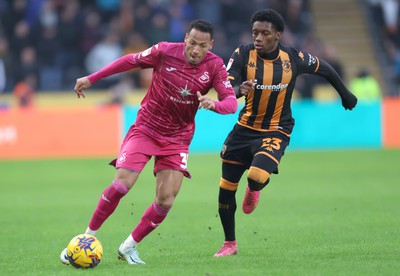 100224 - Hull City v Swansea City - Sky Bet Championship - Ronald of Swansea and Jaden Philogene of Hull City