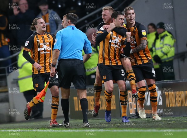 221218 - Hull City v Swansea City - Sky Bet Championship -Tommy Elphick of Hull City celebrates his goal with Jordy de Wijs and Jarrod Bowen on top 