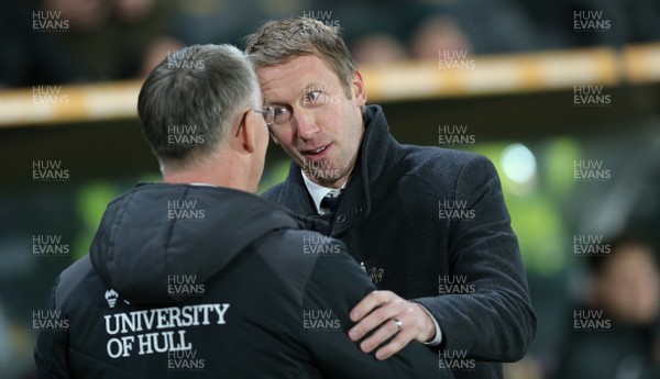 221218 - Hull City v Swansea City - Sky Bet Championship - Manager Graham Potter  of Swansea and Manager Nigel Adkins of Hull City shake hands and have a little friendly chat before the match 