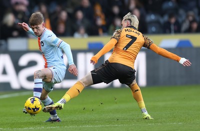 240126 - Hull City v Swansea City - Sky Bet Championship - Ethan Galbraith of Swansea and Liam Millar of Hull AFC