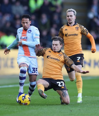 240126 - Hull City v Swansea City - Sky Bet Championship - Ronald of Swansea and Regan Slater of Hull AFC and Liam Millar of Hull AFC
