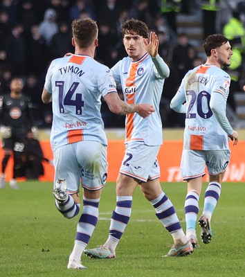 240126 - Hull City v Swansea City - Sky Bet Championship - Josh Key of Swansea City (middle) celebrates Liam Cullen scoring the 1st goal for Swansea with Josh Tymon of Swansea