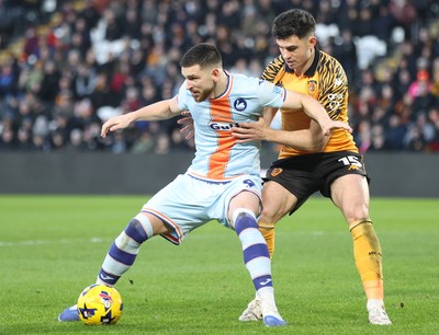240126 - Hull City v Swansea City - Sky Bet Championship - Cameron Burgess of Swansea and Old McBurnie of Hull AFC