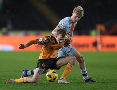 240126 - Hull City v Swansea City - Sky Bet Championship - Melker Widell of Swansea and Matty Jacob of Hull AFC