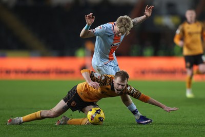 240126 - Hull City v Swansea City - Sky Bet Championship - Melker Widell of Swansea and Matty Jacob of Hull AFC