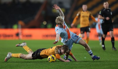 240126 - Hull City v Swansea City - Sky Bet Championship - Melker Widell of Swansea and Matty Jacob of Hull AFC