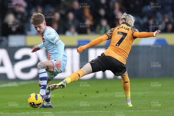 240126 - Hull City v Swansea City - Sky Bet Championship - Ethan Galbraith of Swansea and Liam Millar of Hull AFC