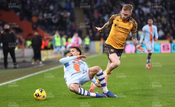 240126 - Hull City v Swansea City - Sky Bet Championship - Cameron Burgess of Swansea and Old McBurnie of Hull AFC