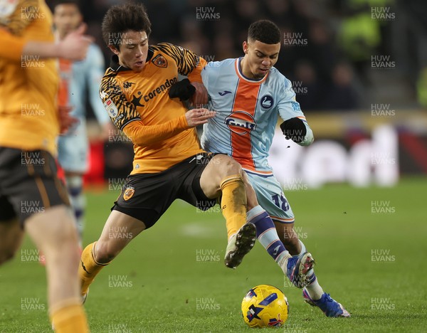 240126 - Hull City v Swansea City - Sky Bet Championship - Gustavo Nunes of Swansea and You Hirahawa of Hull AFC