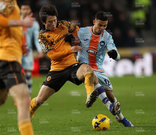 240126 - Hull City v Swansea City - Sky Bet Championship - Gustavo Nunes of Swansea and You Hirahawa of Hull AFC