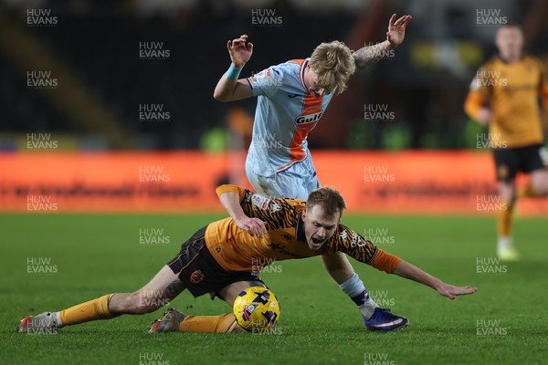 240126 - Hull City v Swansea City - Sky Bet Championship - Melker Widell of Swansea and Matty Jacob of Hull AFC