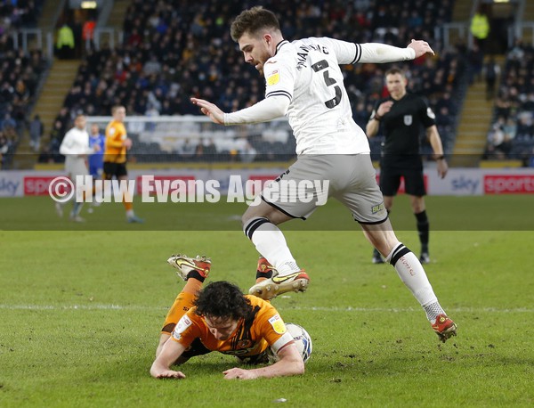 290122 - Hull City v Swansea City - Sky Bet Championship - Ryan Manning  of Swansea fells George Honeyman of Hull City who accuses the Swansea player of stamping on his back
