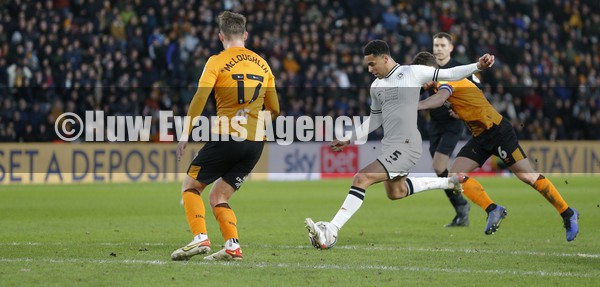 290122 - Hull City v Swansea City - Sky Bet Championship - Ben Cabango of Swansea has a shot on goal