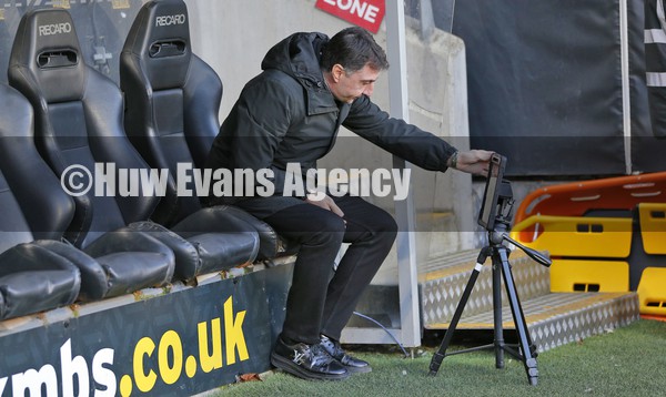 290122 - Hull City v Swansea City - Sky Bet Championship - Manager Shota Arveladze of Hull City adjusts monitor
