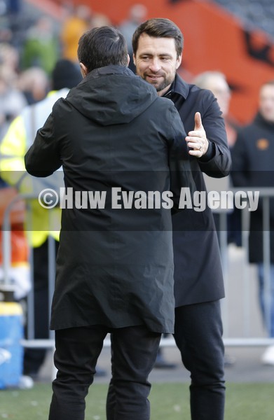 290122 - Hull City v Swansea City - Sky Bet Championship - Manager Shota Arveladze of Hull City before match is greeted by Head Coach Russell Martin  of Swansea