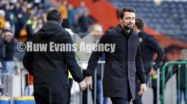 290122 - Hull City v Swansea City - Sky Bet Championship - Manager Shota Arveladze of Hull City before match is greeted by Head Coach Russell Martin  of Swansea
