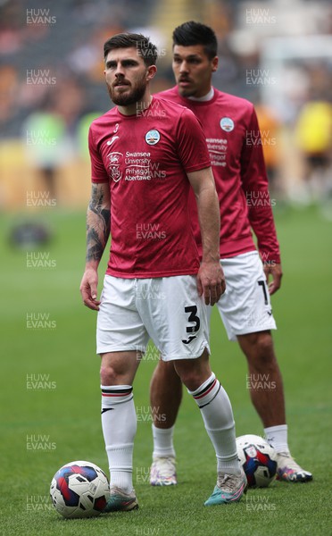 290423 - Hull City v Swansea City - Sky Bet Championship - Ryan Manning of Swansea and Joel Piroe of Swansea warm up before the match