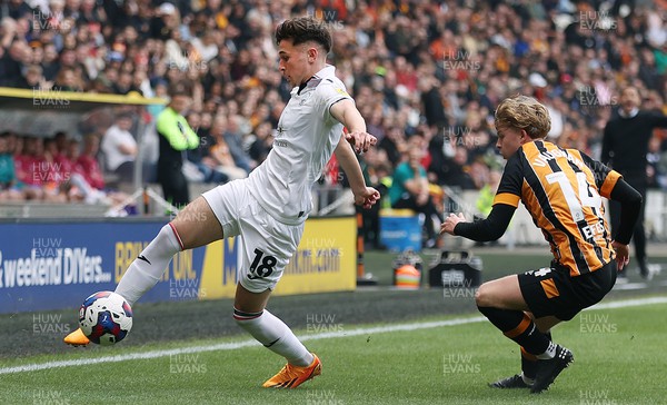 290423 - Hull City v Swansea City - Sky Bet Championship - Luke Cundle of Swansea manages the ball under the watchful eye of Harry Vaughan of Hull City 